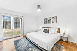 Prime SoCo comfy 2BR king suite w/ pool, parking - Image 3